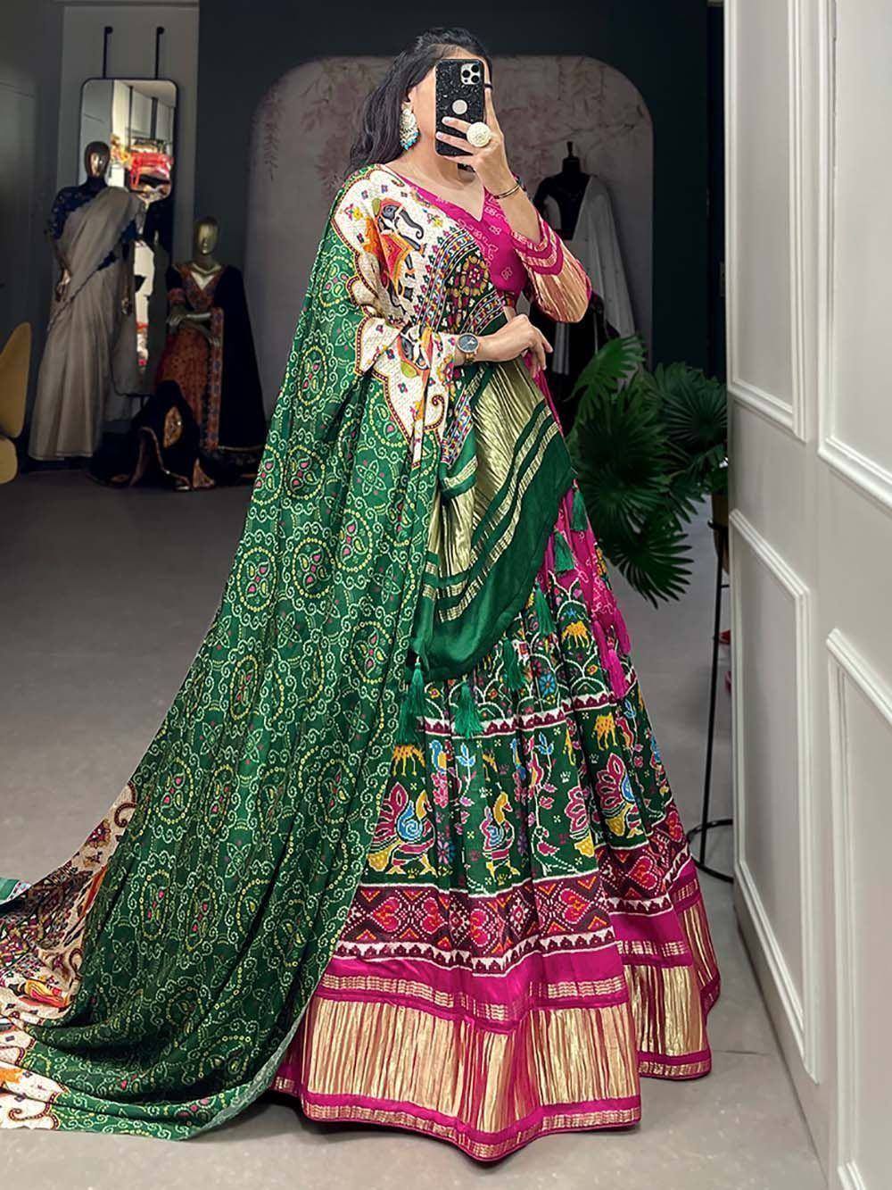 Vibrant green and pink printed lehenga choli with elephant motifs, perfect for Indian ethnic wear occasions.