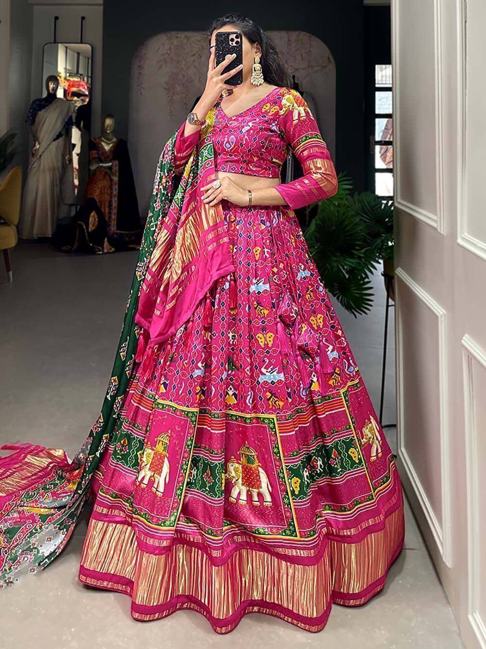 Vibrant pink lehenga choli with elephant print, perfect for Indian ethnic wear and festive occasions.