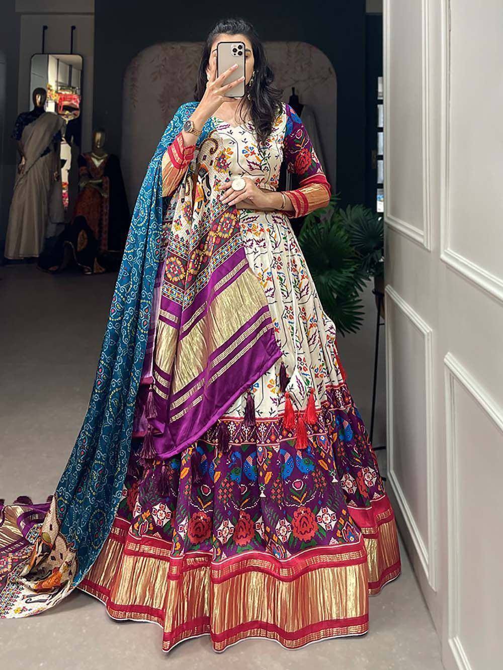 Woman in colorful embroidered Indian lehenga choli with dupatta, perfect for weddings and festivals