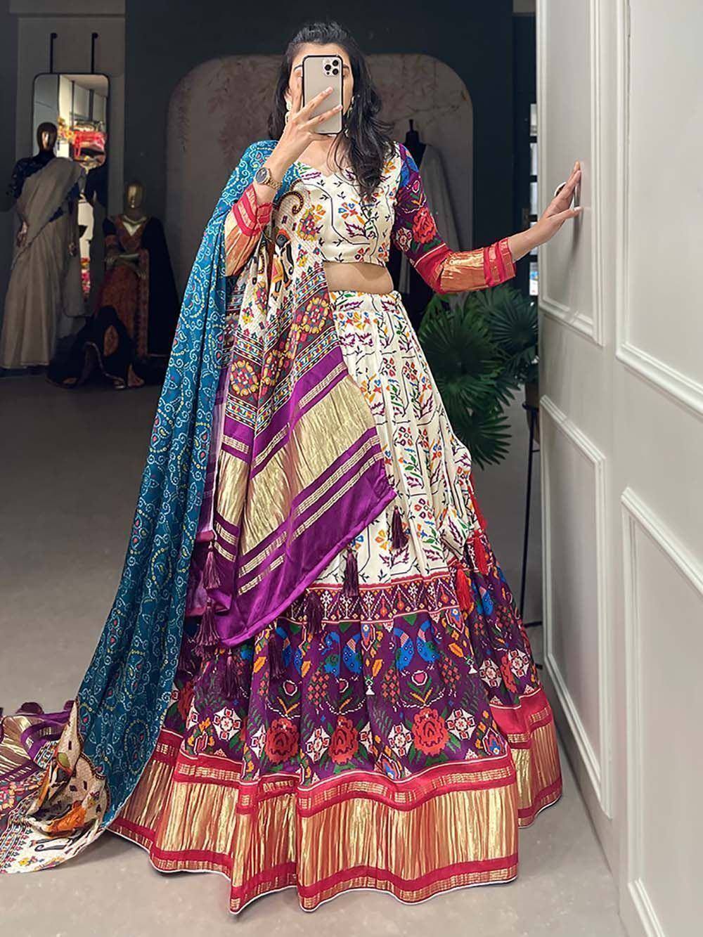 Colorful embroidered lehenga choli with blue dupatta, perfect for Indian ethnic wear occasions