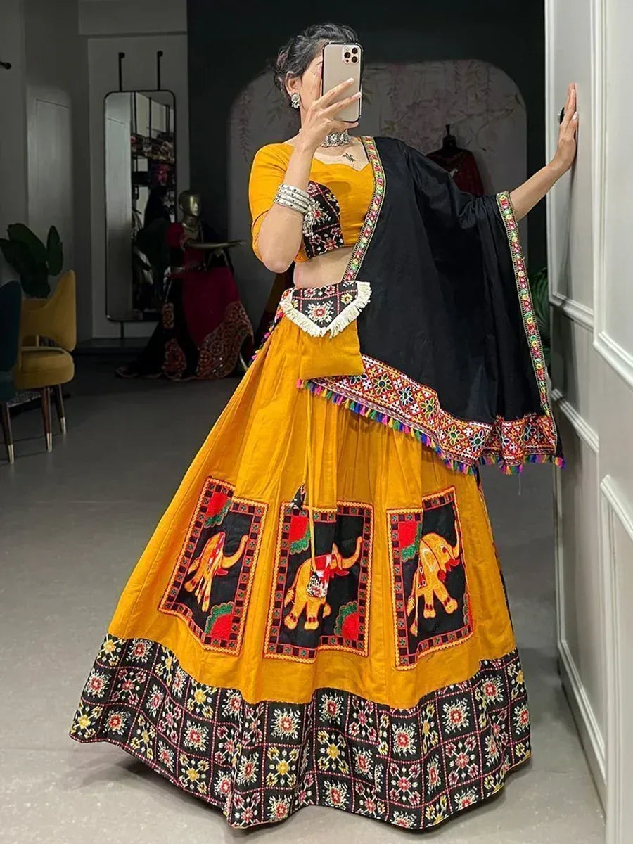 Yellow and black embroidered lehenga choli with elephant motifs, perfect for Indian ethnic wear