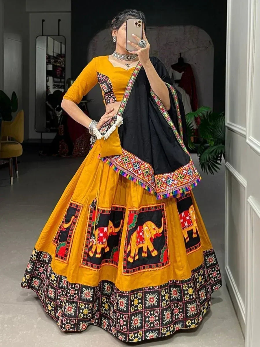 Yellow and black embroidered lehenga choli with elephant motifs, perfect for Indian ethnic wear occasions.