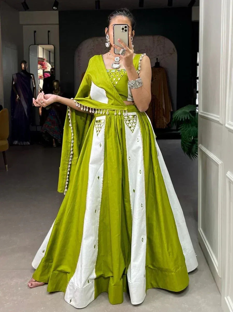 Green and white designer lehenga choli with mirror work, perfect for Indian ethnic occasions
