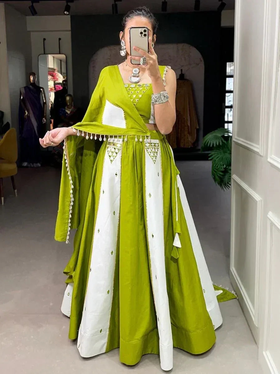 Green and white designer lehenga choli with geometric embroidery, perfect for Indian ethnic wear occasions