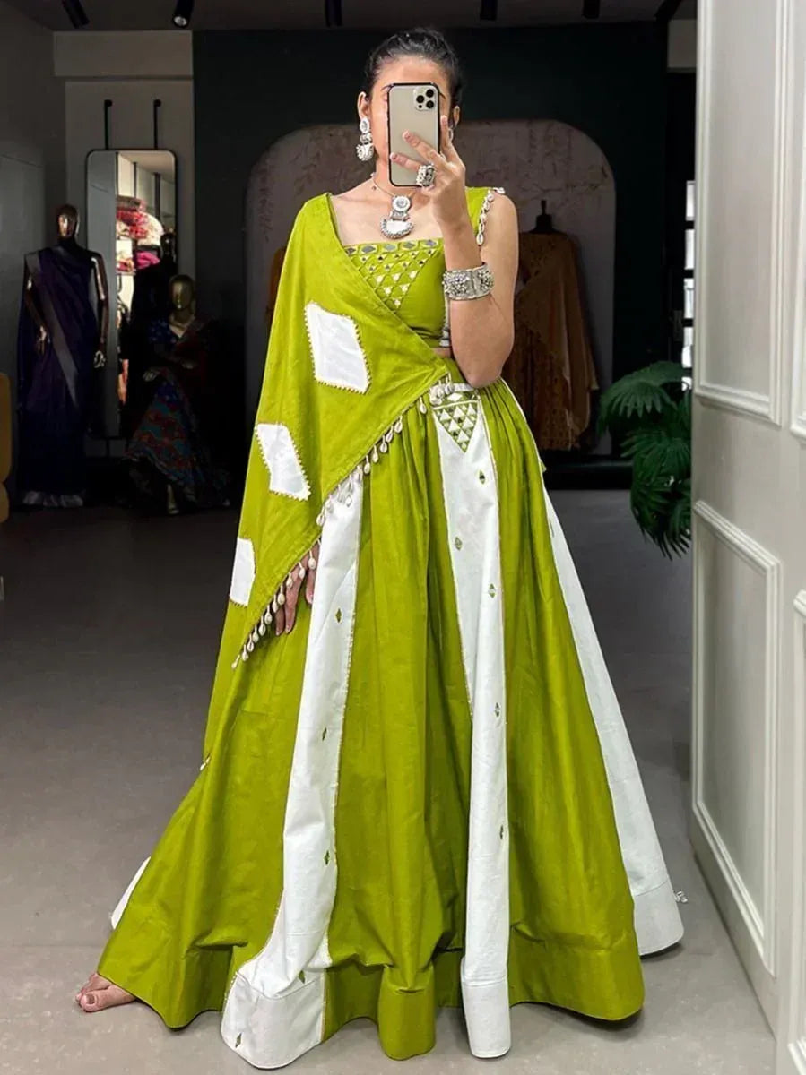 Green and white designer lehenga choli with mirror work, perfect for Indian ethnic occasions