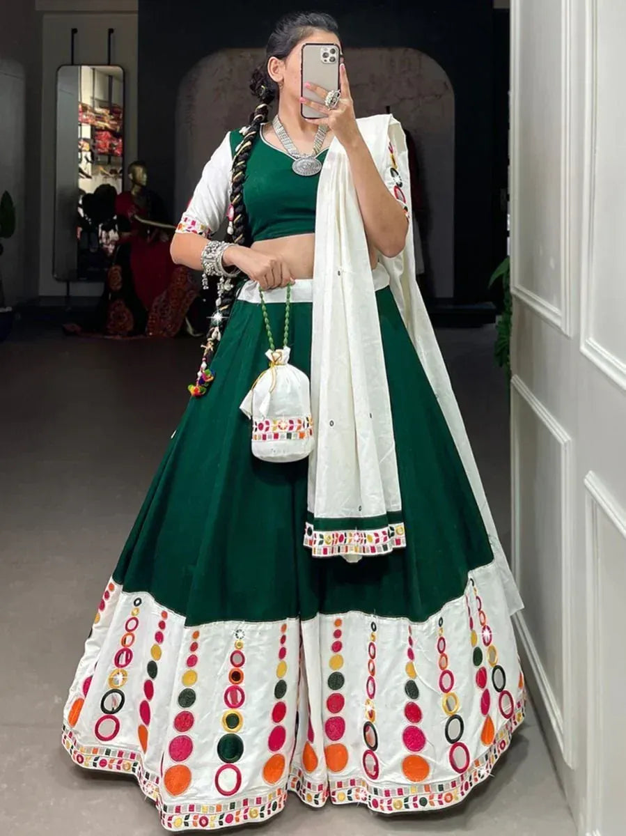 Green and white embroidered lehenga choli with mirror work, perfect for Indian ethnic wear occasions