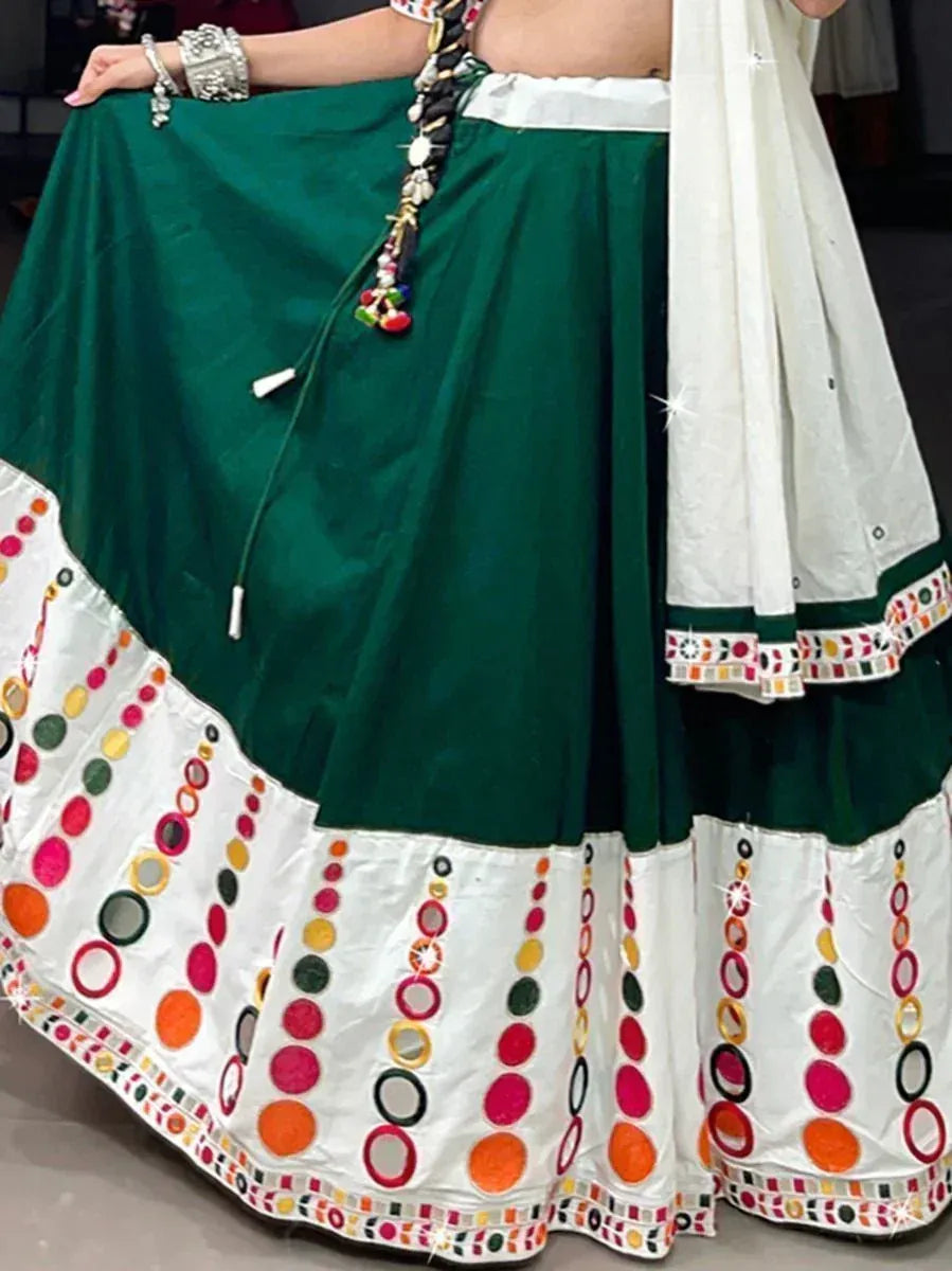 Green and white embroidered lehenga choli with mirror work, perfect for Indian ethnic wear occasions.