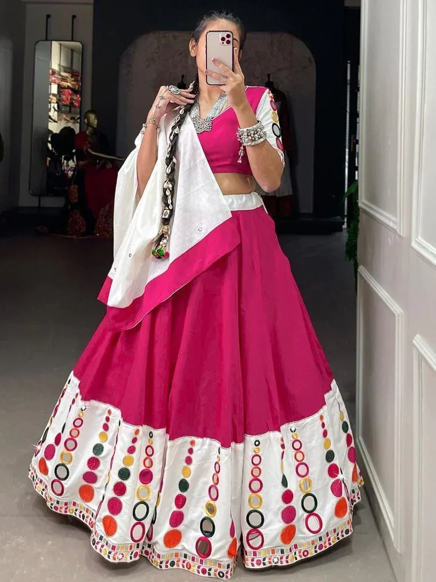 Pink and white embroidered lehenga choli with colorful circular motifs, perfect for Indian ethnic occasions