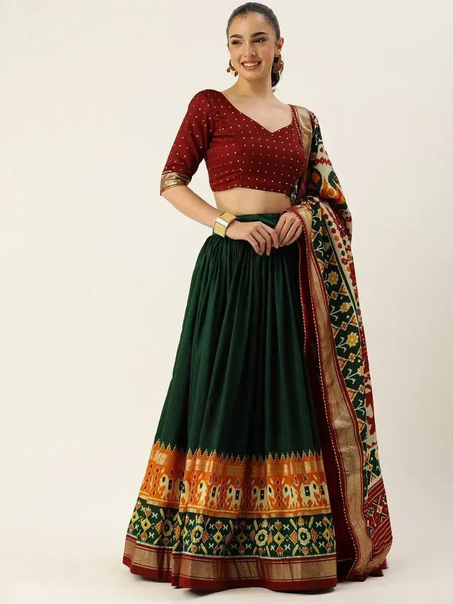 Red and green ethnic lehenga choli with printed dupatta, perfect for Indian weddings and festivals