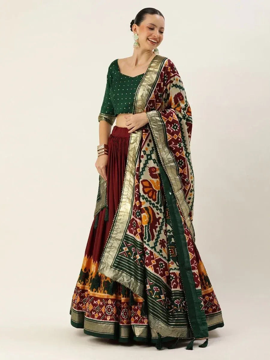 Green and maroon printed lehenga choli with ethnic floral dupatta, perfect for Indian weddings and festivals