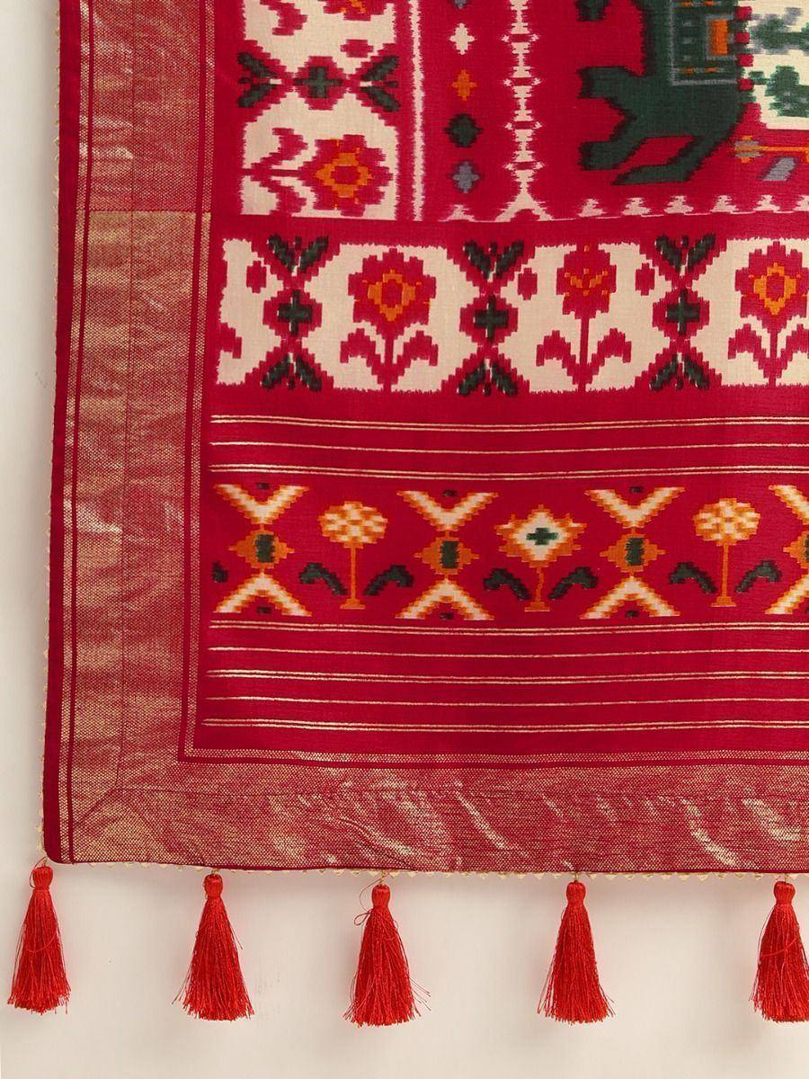 Red ethnic saree with floral ikat patterns and tassels, perfect for Indian traditional wear