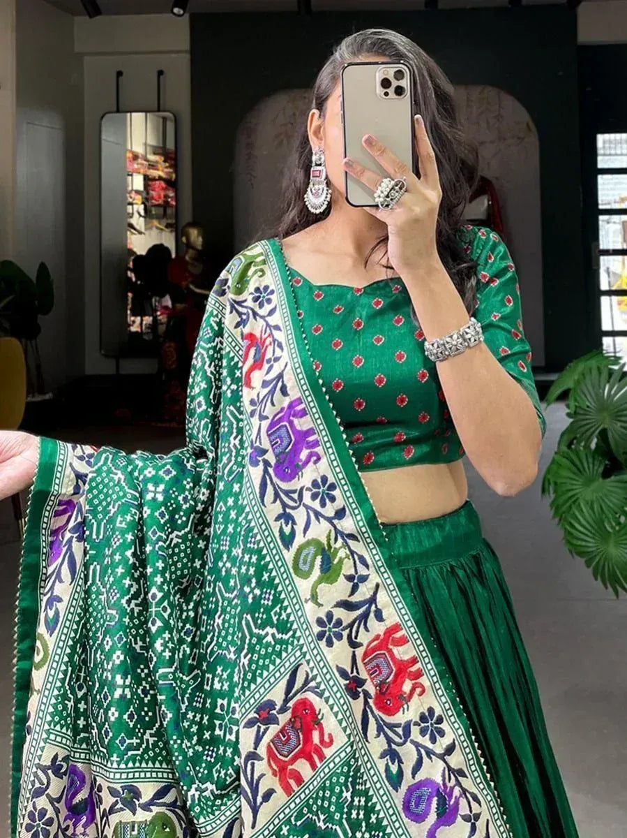 Green printed lehenga choli with colorful elephant motifs, perfect for ethnic occasions