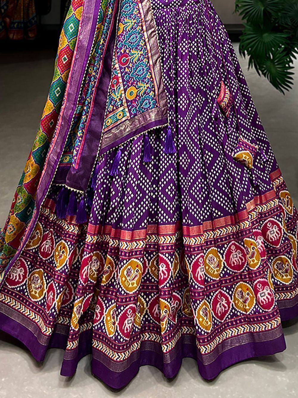 Purple printed lehenga with colorful elephant motifs and tassel border, ethnic Indian wear