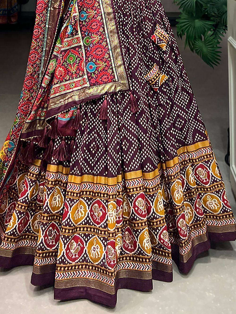 Purple printed lehenga choli with elephant motifs and tassels, ethnic Indian wear