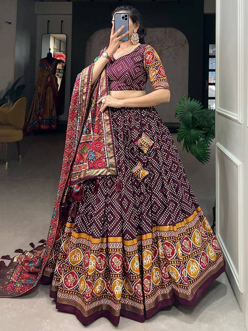 Purple printed lehenga choli with ethnic motifs and dupatta, perfect for Indian weddings and festive occasions