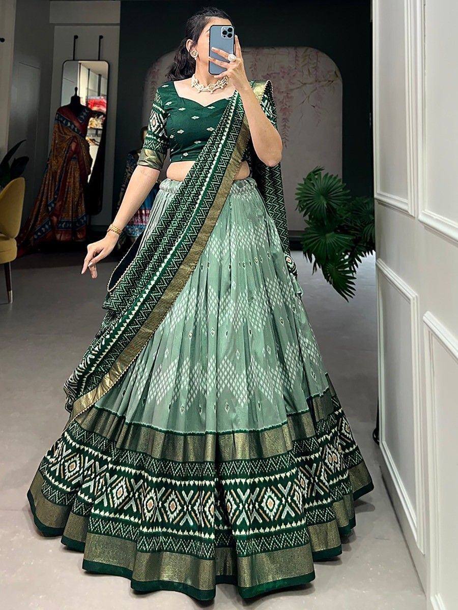 Green printed lehenga choli with ethnic patterns, perfect for Indian weddings and festive occasions