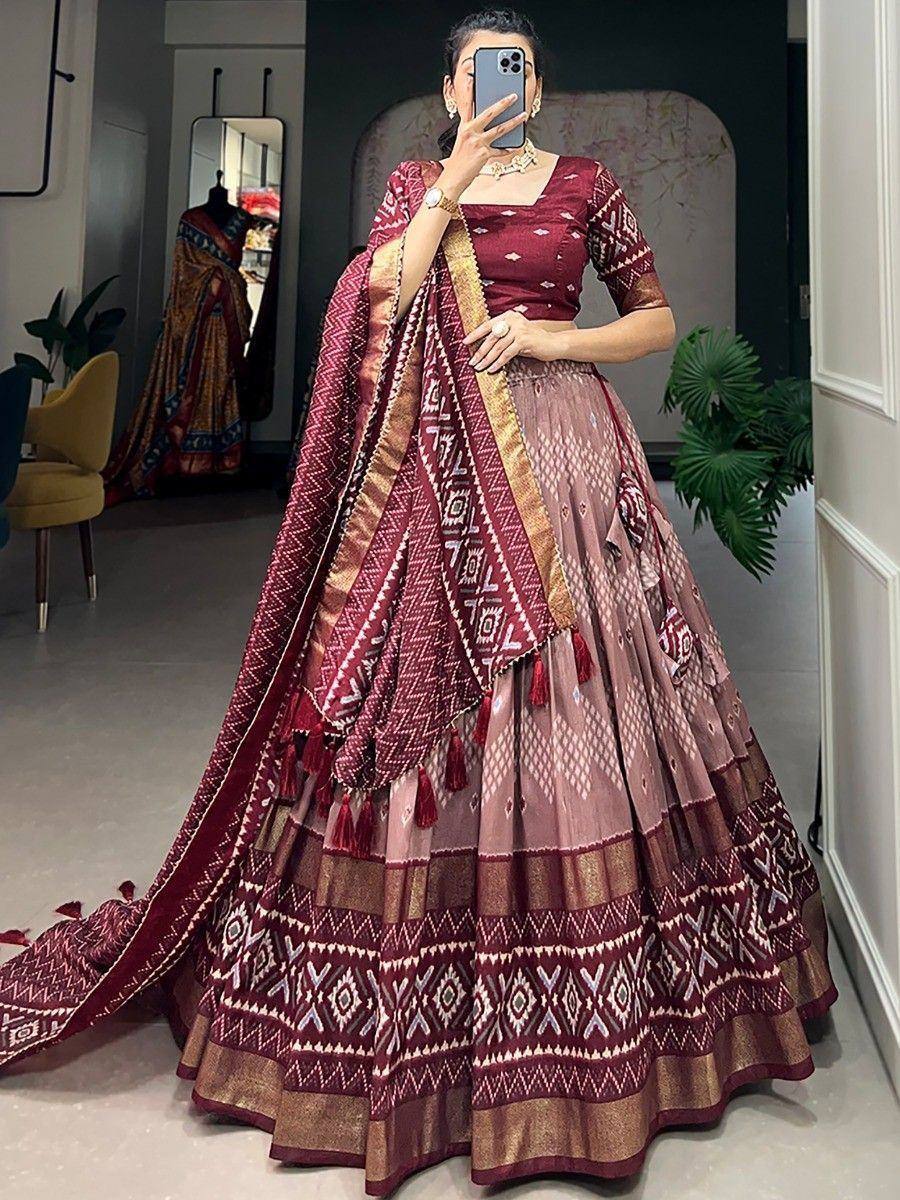 Maroon and beige printed lehenga choli with geometric patterns and tassels, perfect for Indian ethnic occasions