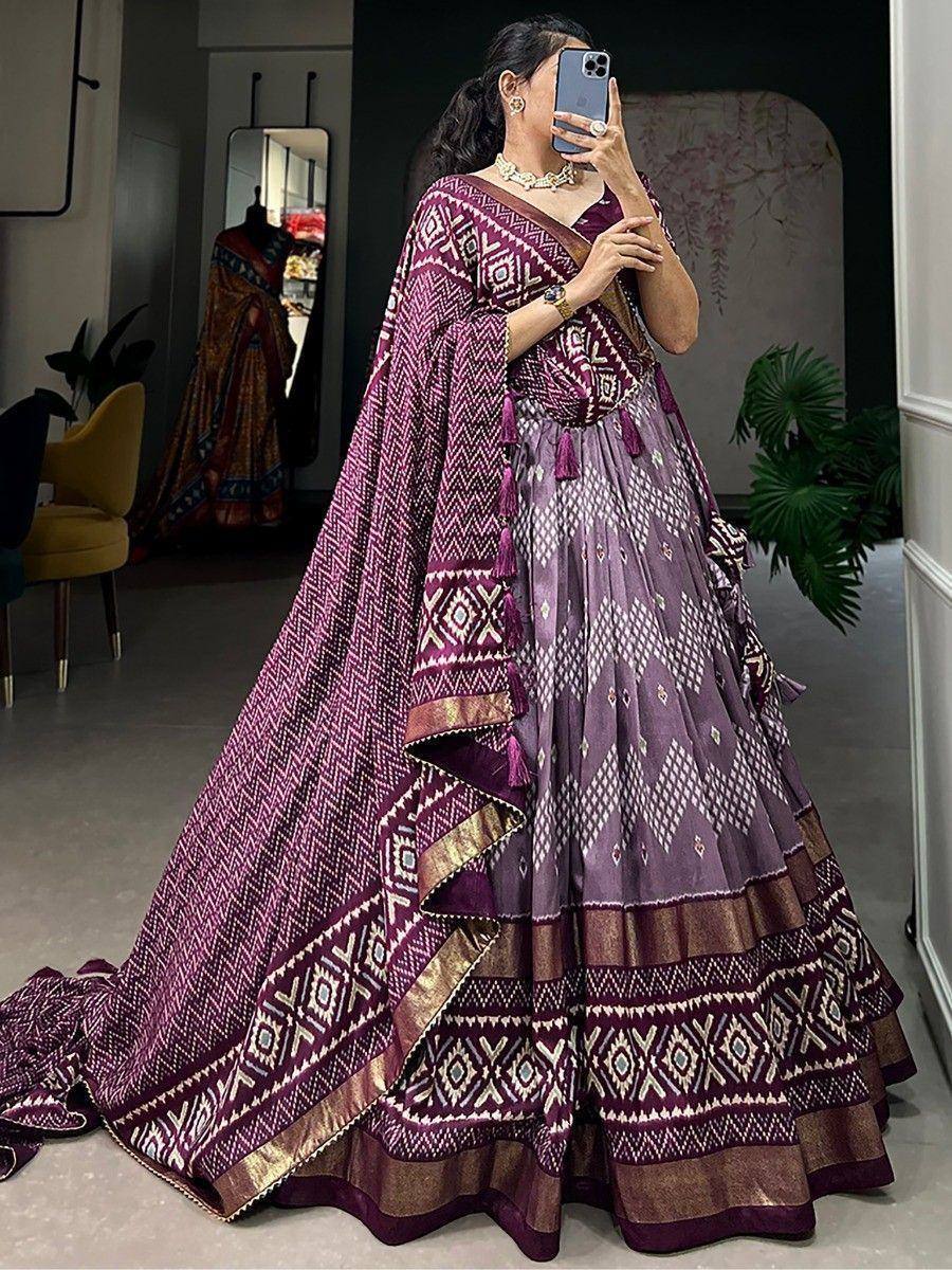 Purple printed lehenga choli with geometric patterns and tassels, perfect for Indian ethnic wear occasions