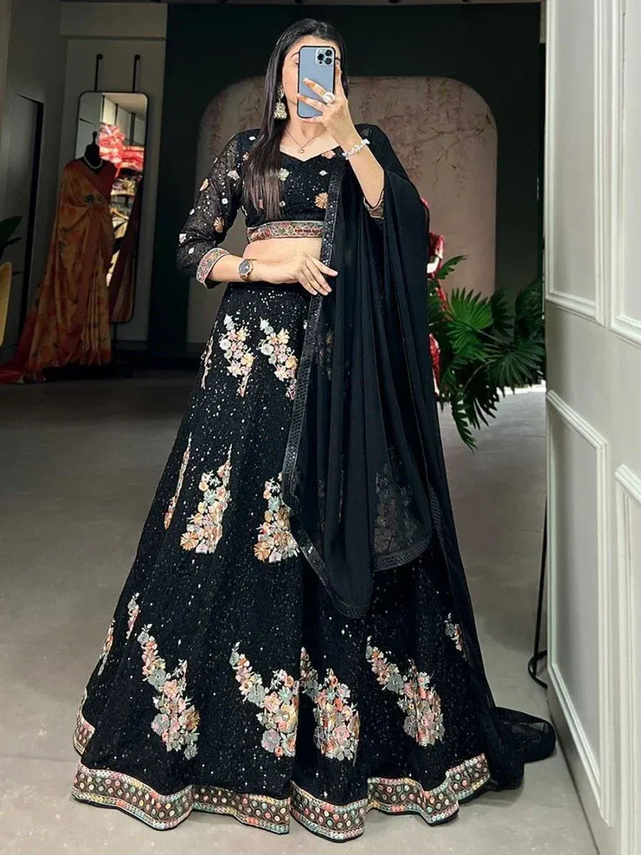 Black floral embroidered lehenga choli with net dupatta, perfect for weddings and parties