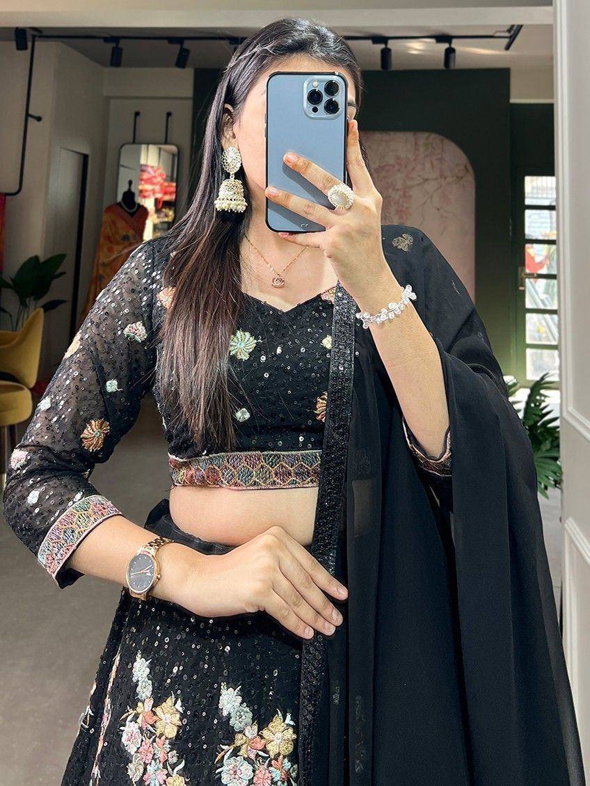 Black floral embroidered lehenga choli with sheer dupatta, perfect for Indian ethnic occasions