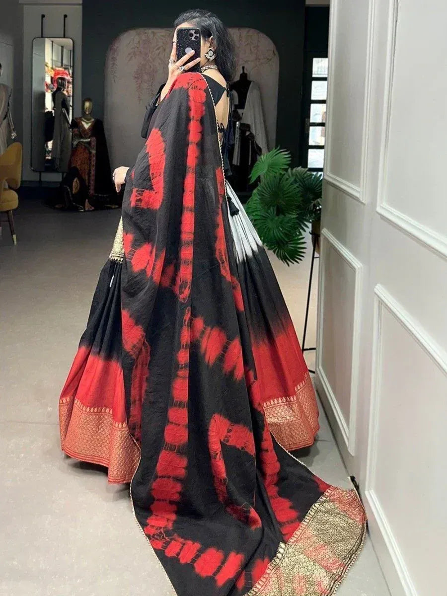 Black and red tie-dye lehenga choli with gold border, ethnic Indian wear for women