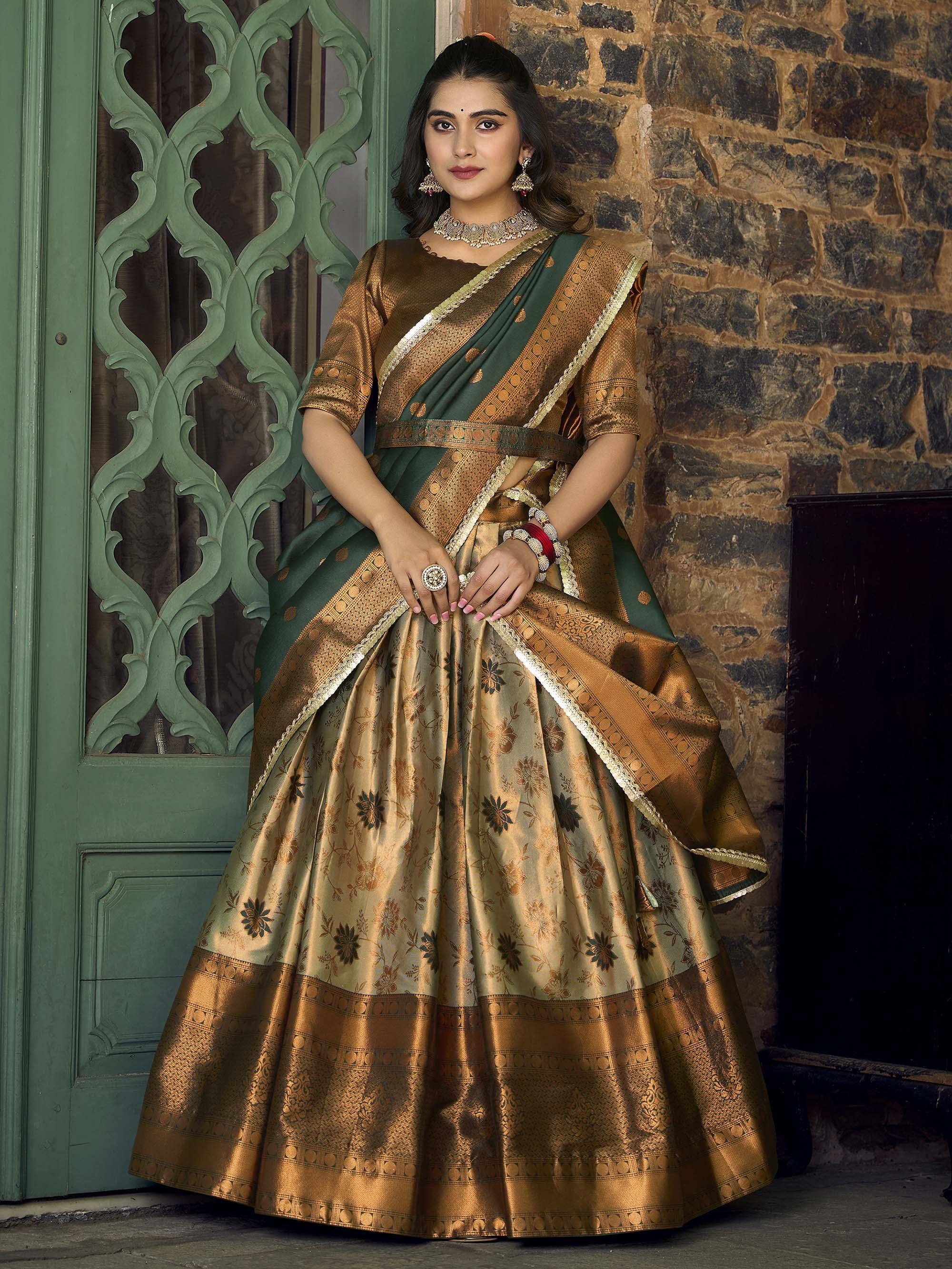 Elegant green and gold designer lehenga choli with floral motifs, perfect for Indian ethnic wear occasions.