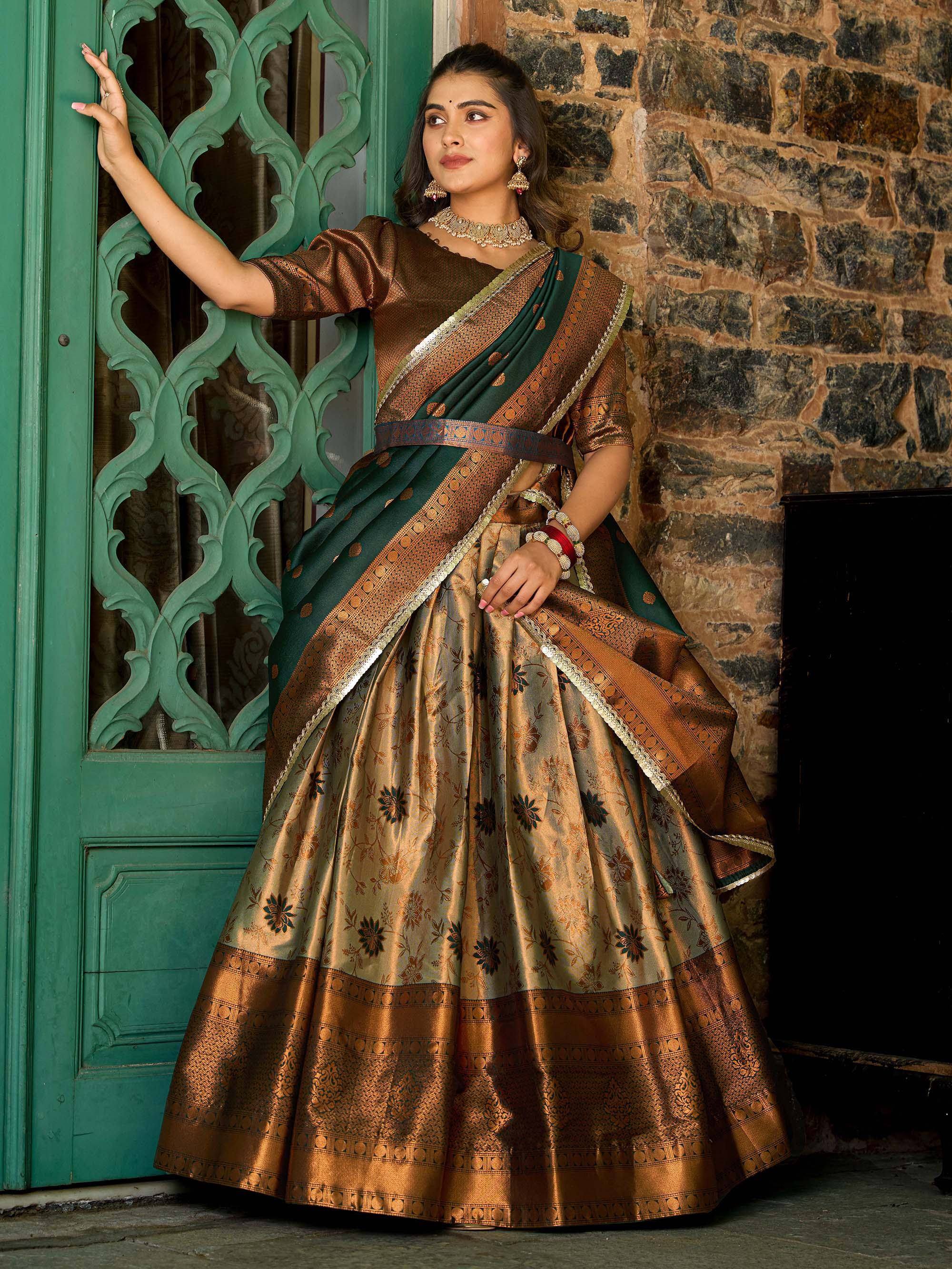 Elegant green and gold designer lehenga choli with intricate floral patterns, perfect for Indian ethnic wear.