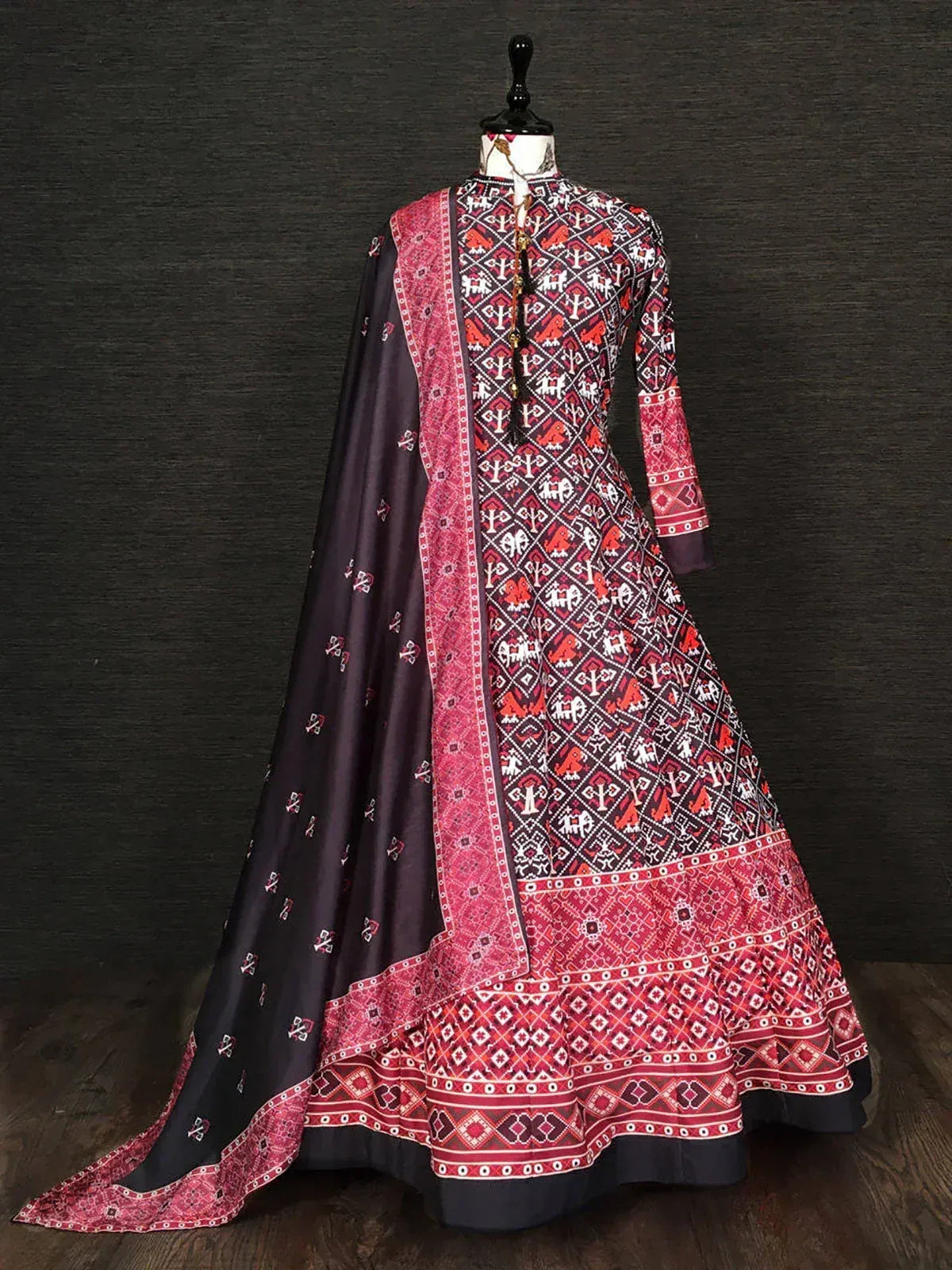 Black and red ethnic gown with traditional geometric patterns and matching dupatta