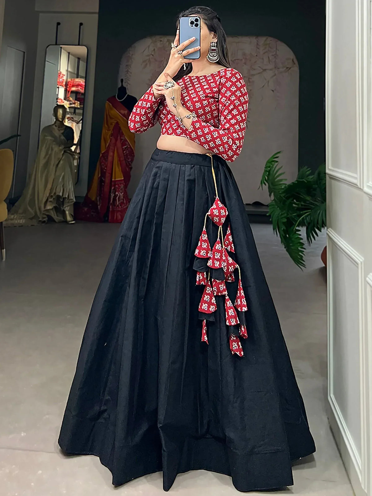 Red printed crop top with black pleated lehenga skirt, ethnic Indian wear for women