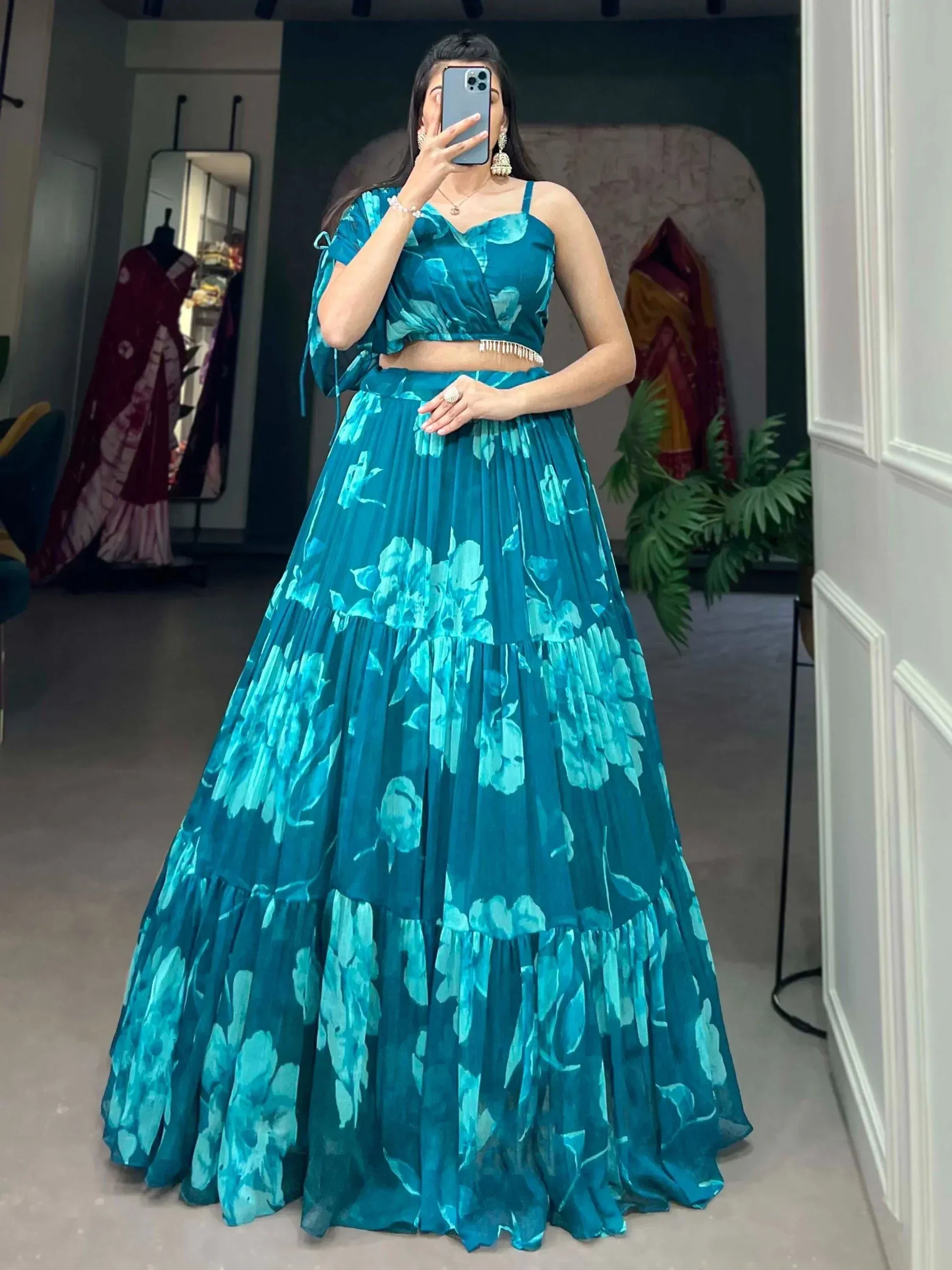 Teal floral print lehenga choli with ruffled skirt and crop top, perfect for Indian ethnic occasions