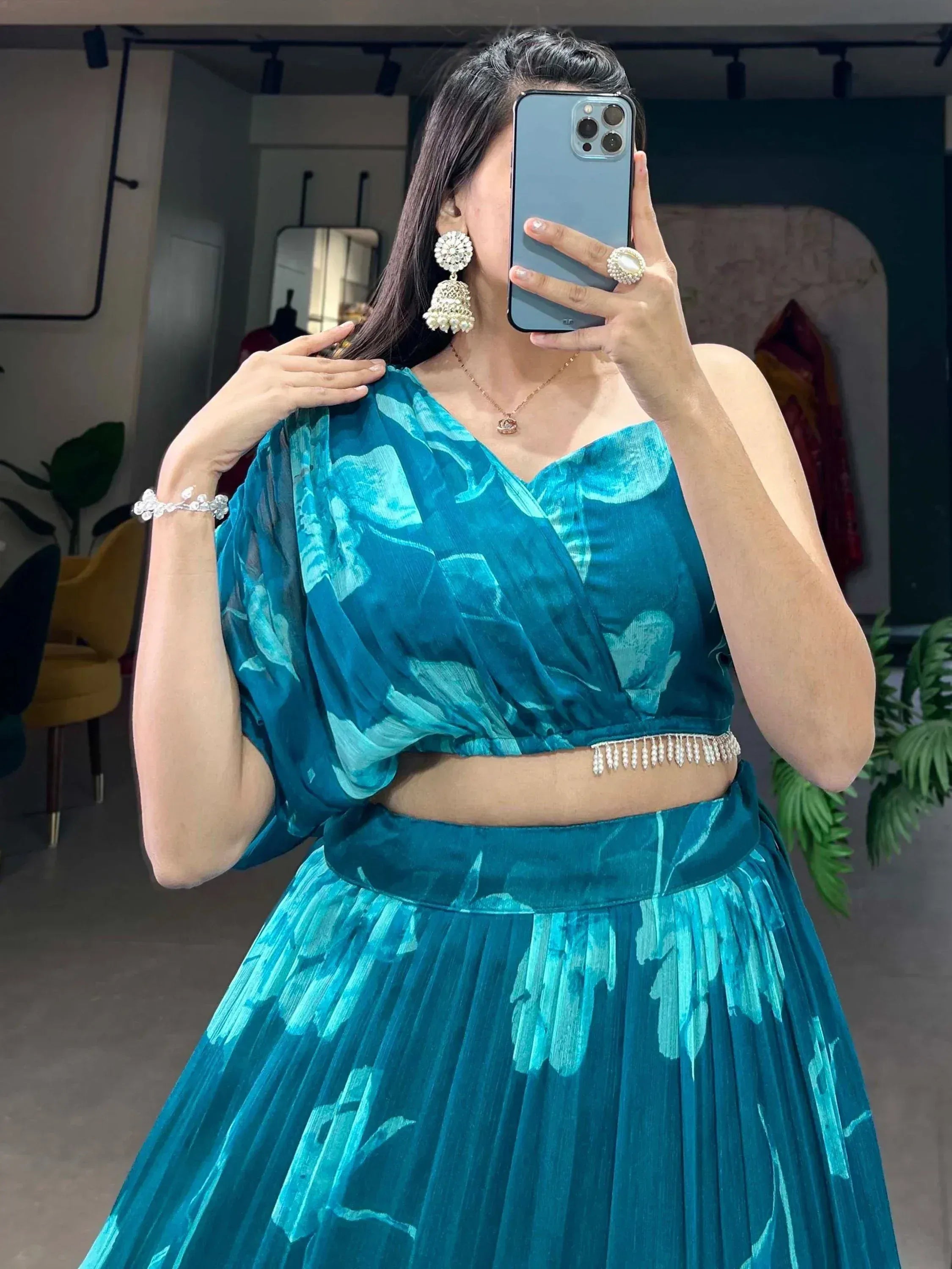 Teal floral lehenga choli with pearl belt, perfect for Indian ethnic wear and festive occasions.