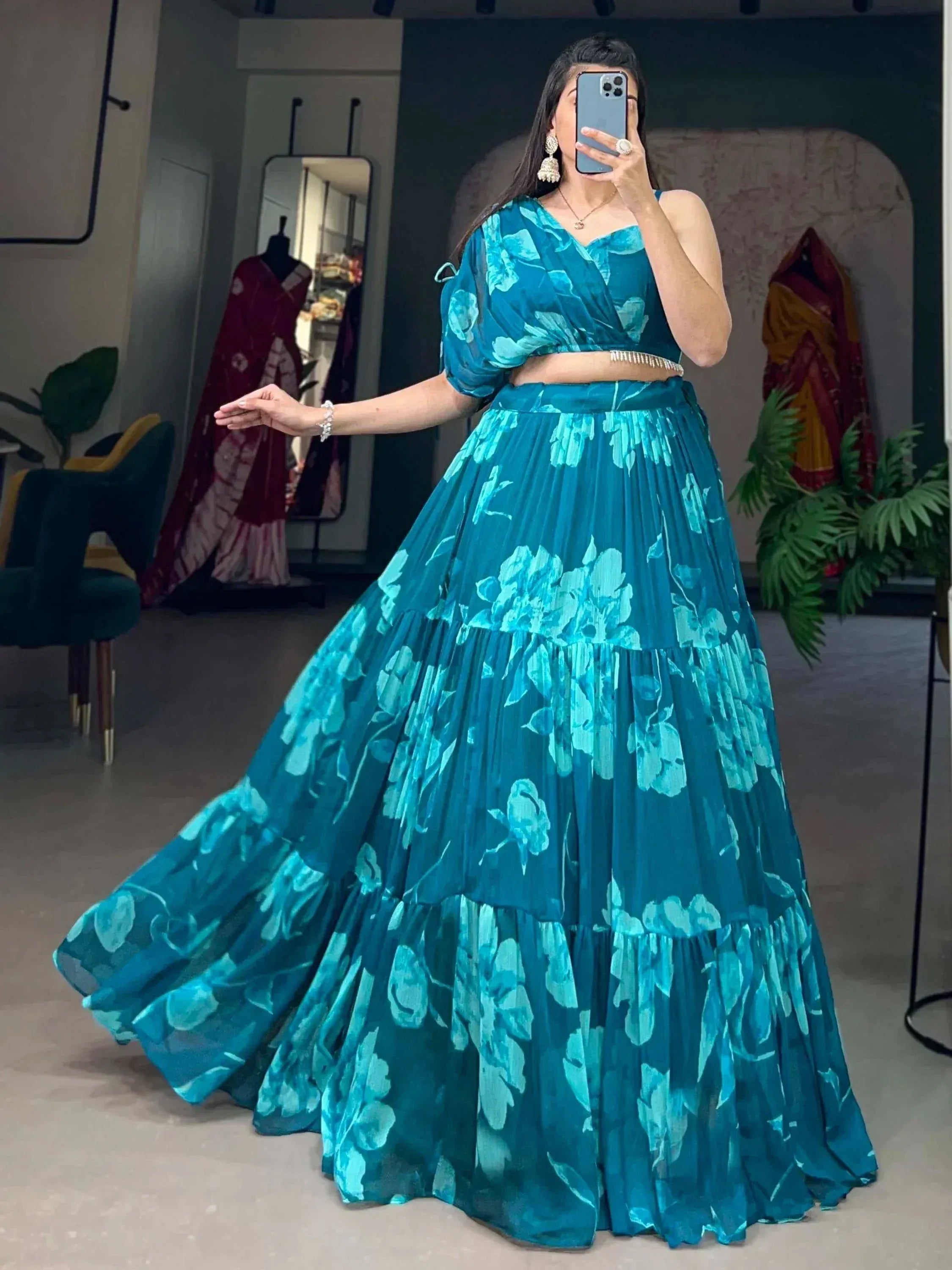 Teal floral lehenga choli with tiered skirt, perfect for Indian ethnic wear events