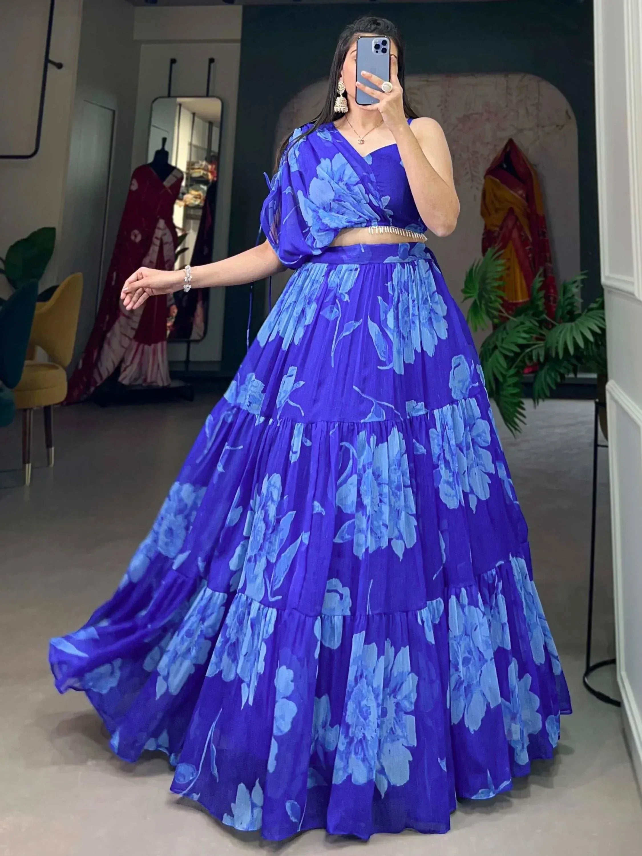 Blue floral lehenga choli with tiered skirt, perfect for Indian ethnic wear and festive occasions.