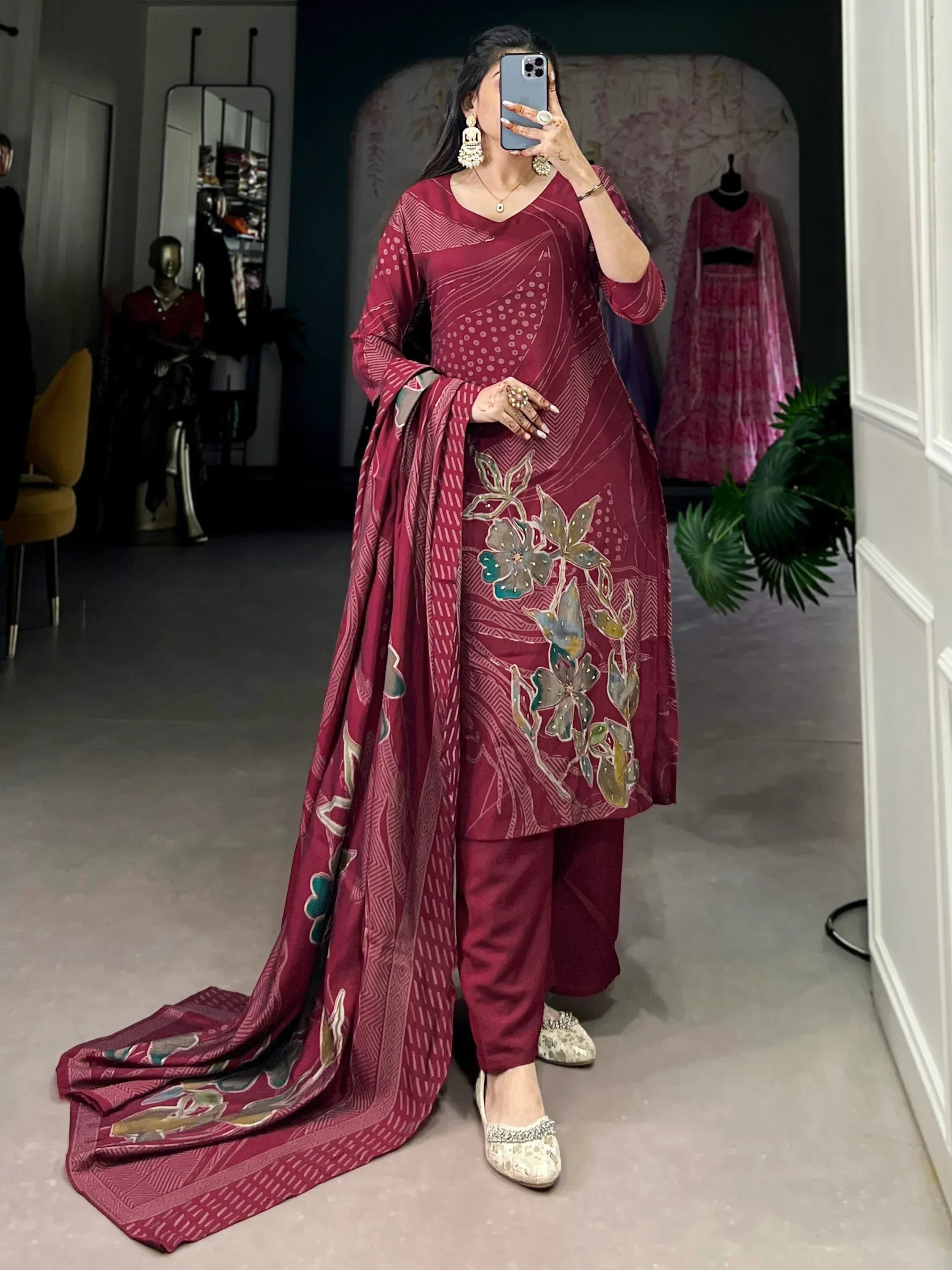 Maroon printed salwar kameez with floral embroidery, perfect for ethnic occasions and festive wear.