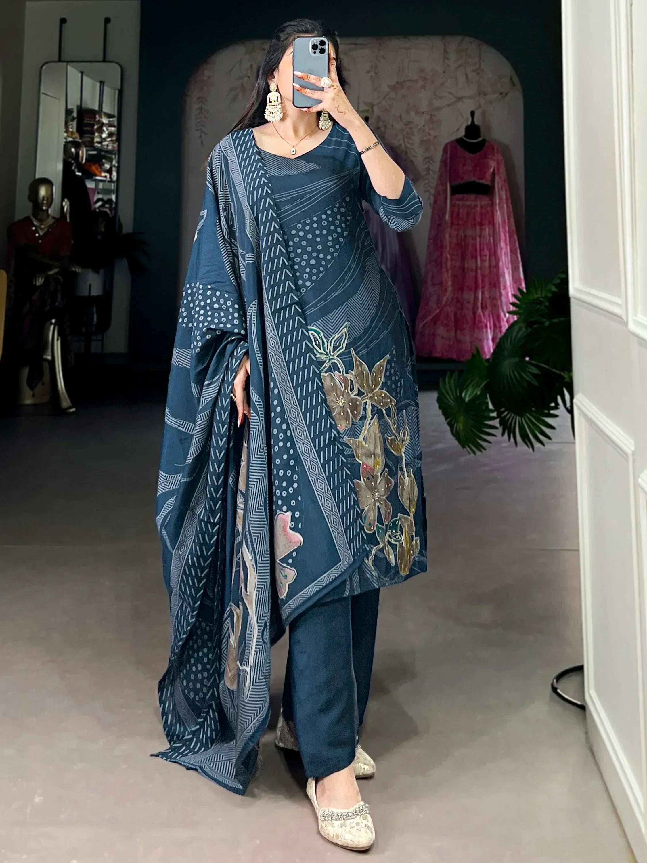 Woman in blue printed salwar kameez with floral embroidery, ethnic wear outfit