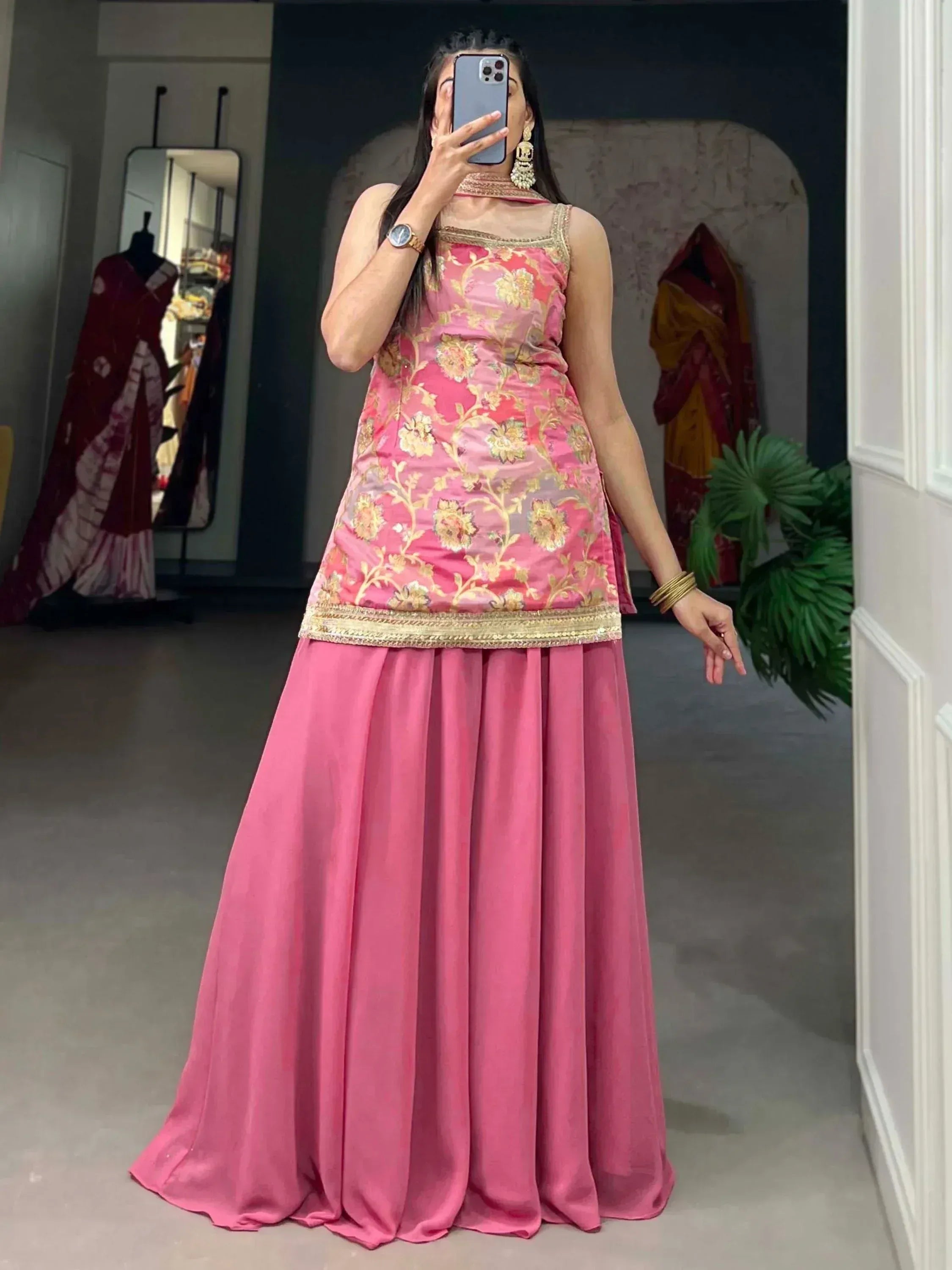 Pink floral embroidered ethnic gown with gold detailing, perfect for Indian occasions and events