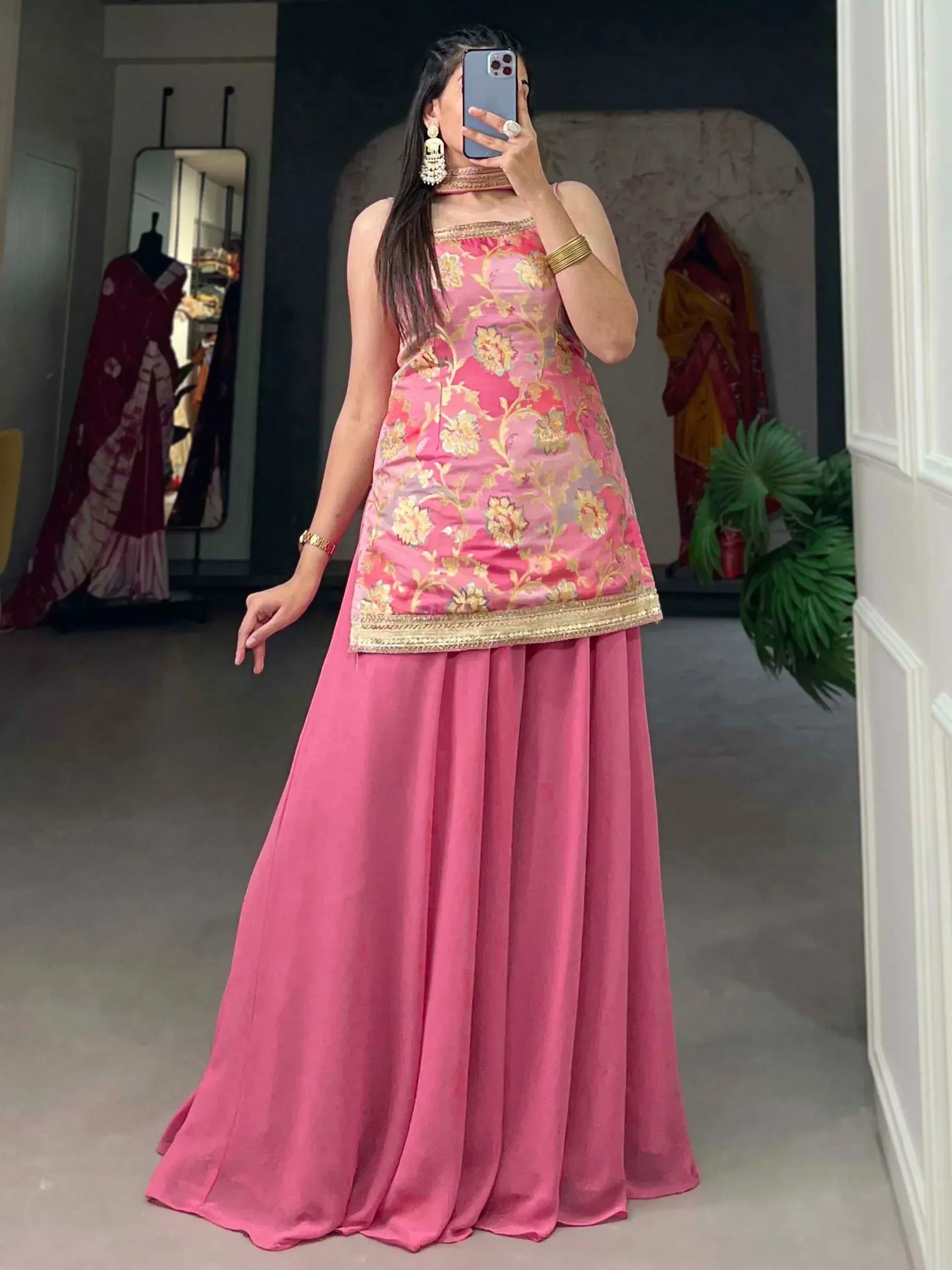 Pink floral embroidered ethnic gown with gold trim, perfect for Indian occasions and celebrations