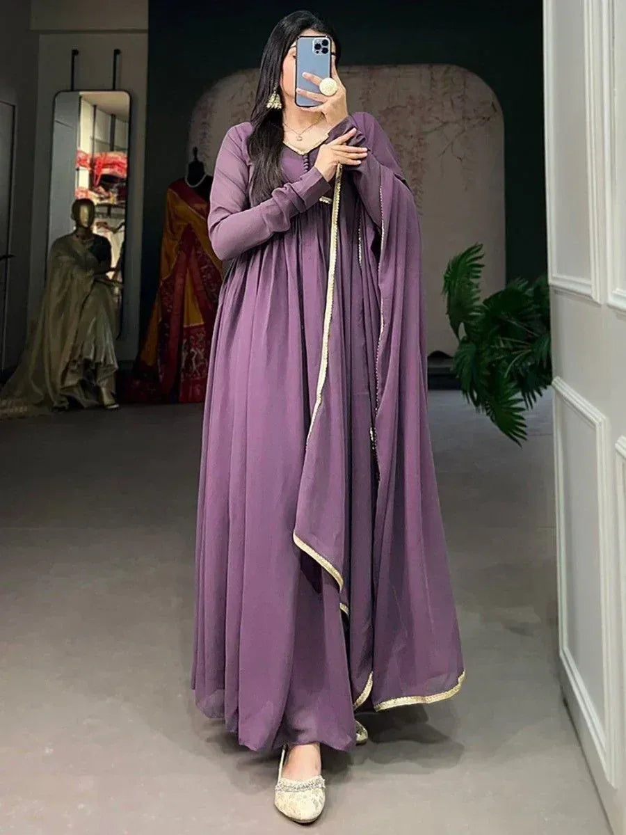 Purple ethnic gown with gold trim, perfect for Indian occasions and festive wear