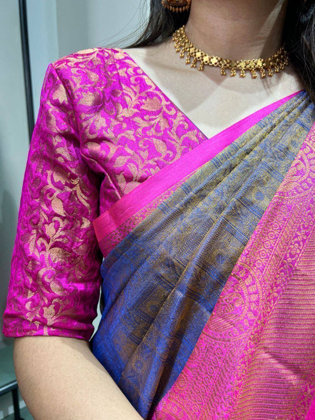 Vibrant pink and blue designer saree with gold floral blouse, perfect for Indian ethnic wear occasions