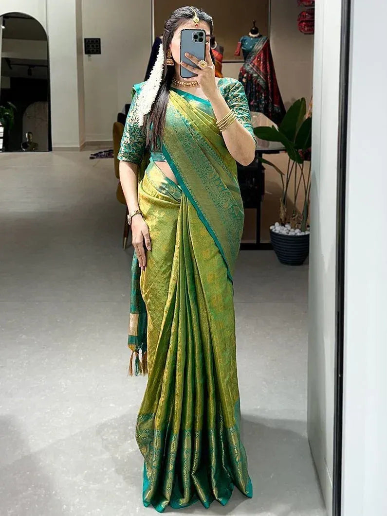 Woman in green designer saree with gold embroidery, perfect for Indian ethnic occasions