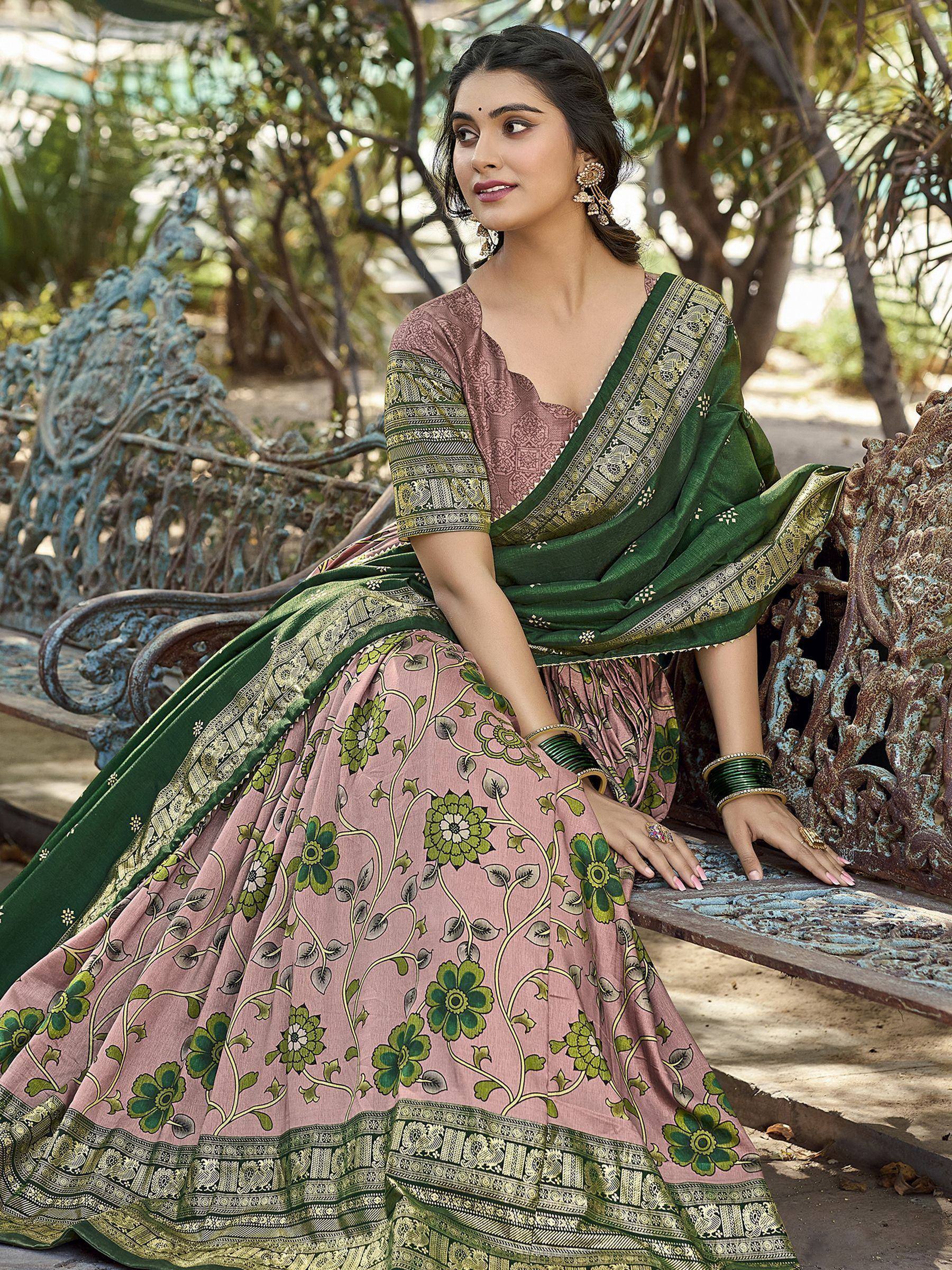 Woman in pink floral lehenga choli with green dupatta, traditional Indian ethnic wear