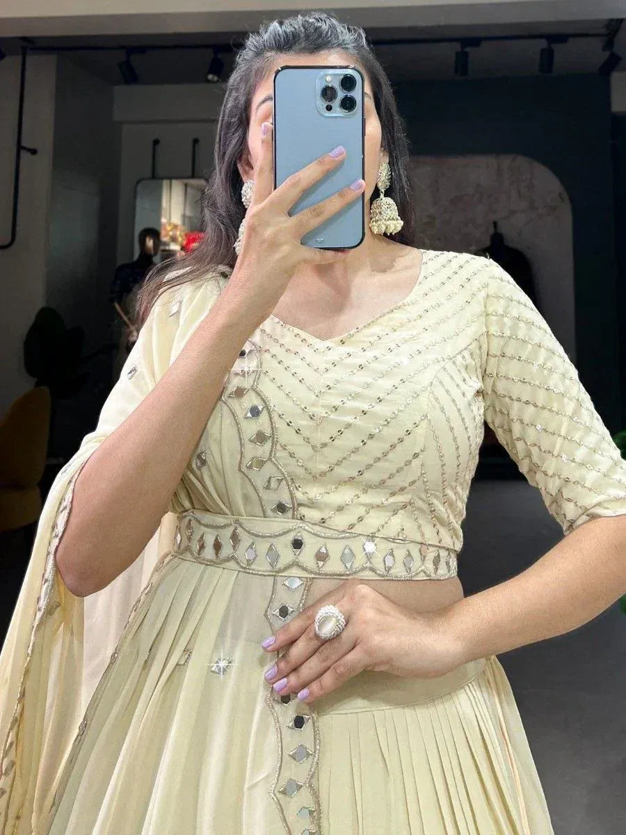 Cream embroidered lehenga choli with mirror work, perfect for Indian ethnic wear occasions