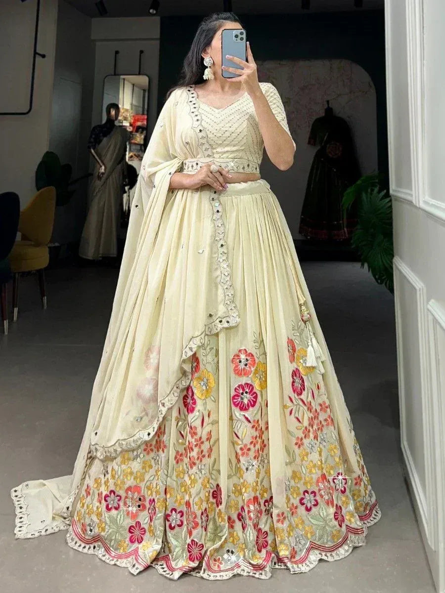 Cream floral embroidered lehenga choli with mirror work, perfect for Indian ethnic occasions