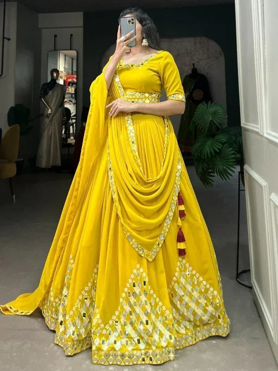 Vibrant yellow lehenga choli with mirror work and tassels, perfect for Indian ethnic occasions