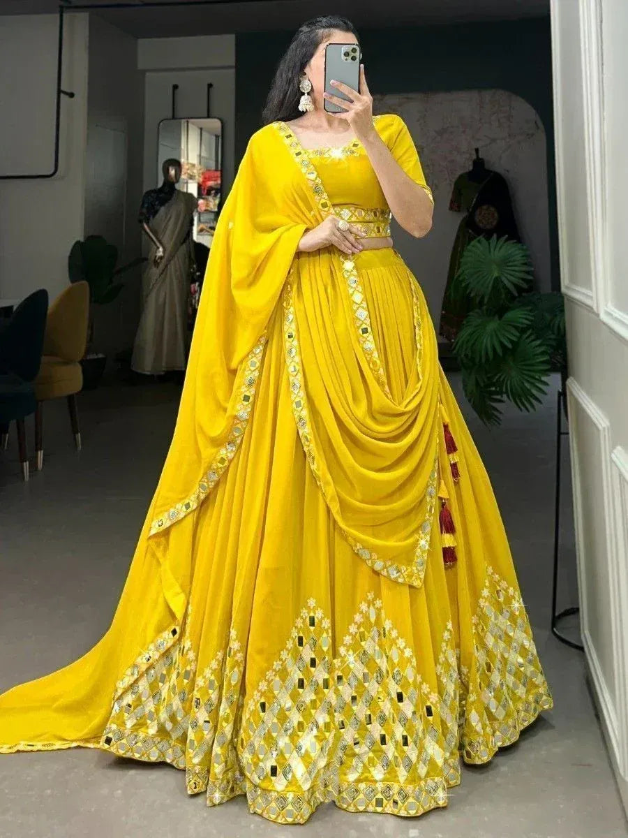 Vibrant yellow lehenga choli with mirror work and dupatta, perfect for Indian ethnic occasions