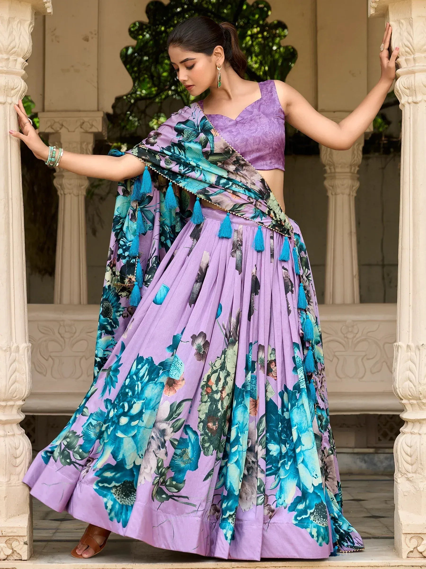 Purple floral lehenga choli with blue tassels, perfect for Indian ethnic wear occasions
