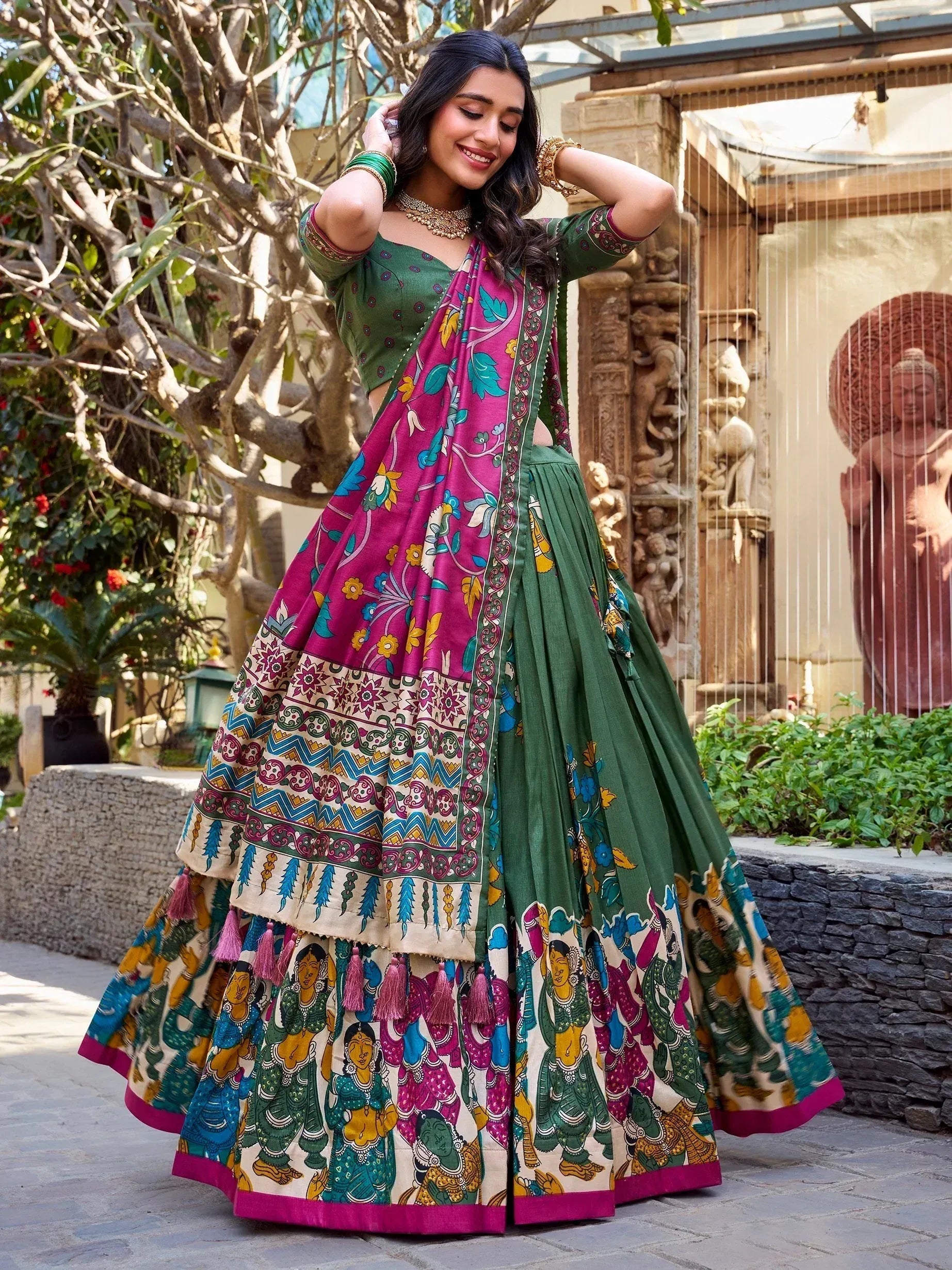 Green and pink printed lehenga choli with floral and tribal motifs, perfect for Indian ethnic wear occasions
