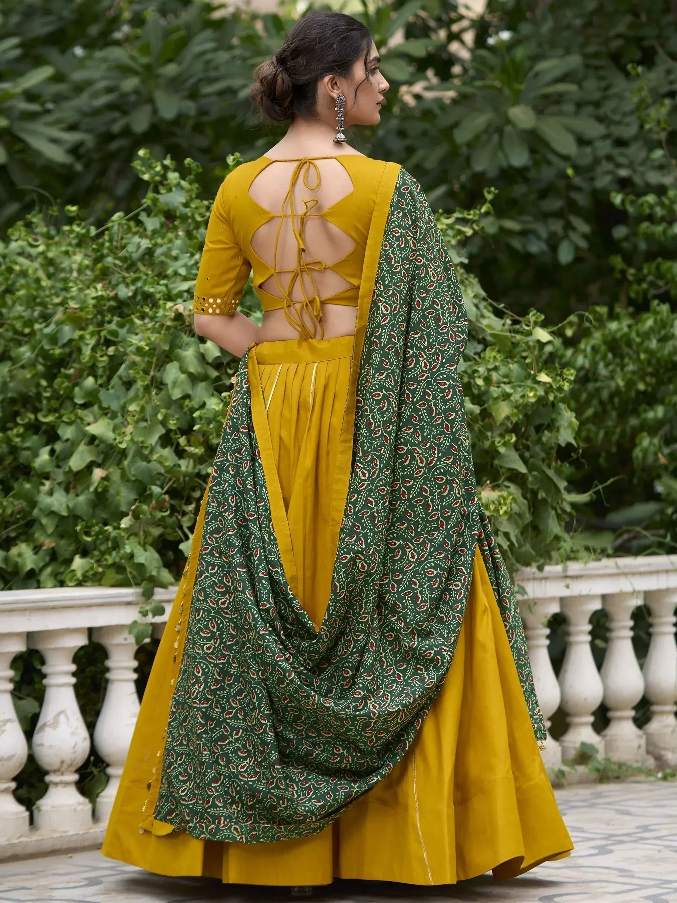 Mustard yellow lehenga choli with green printed dupatta, back tie-up blouse, ethnic Indian wear