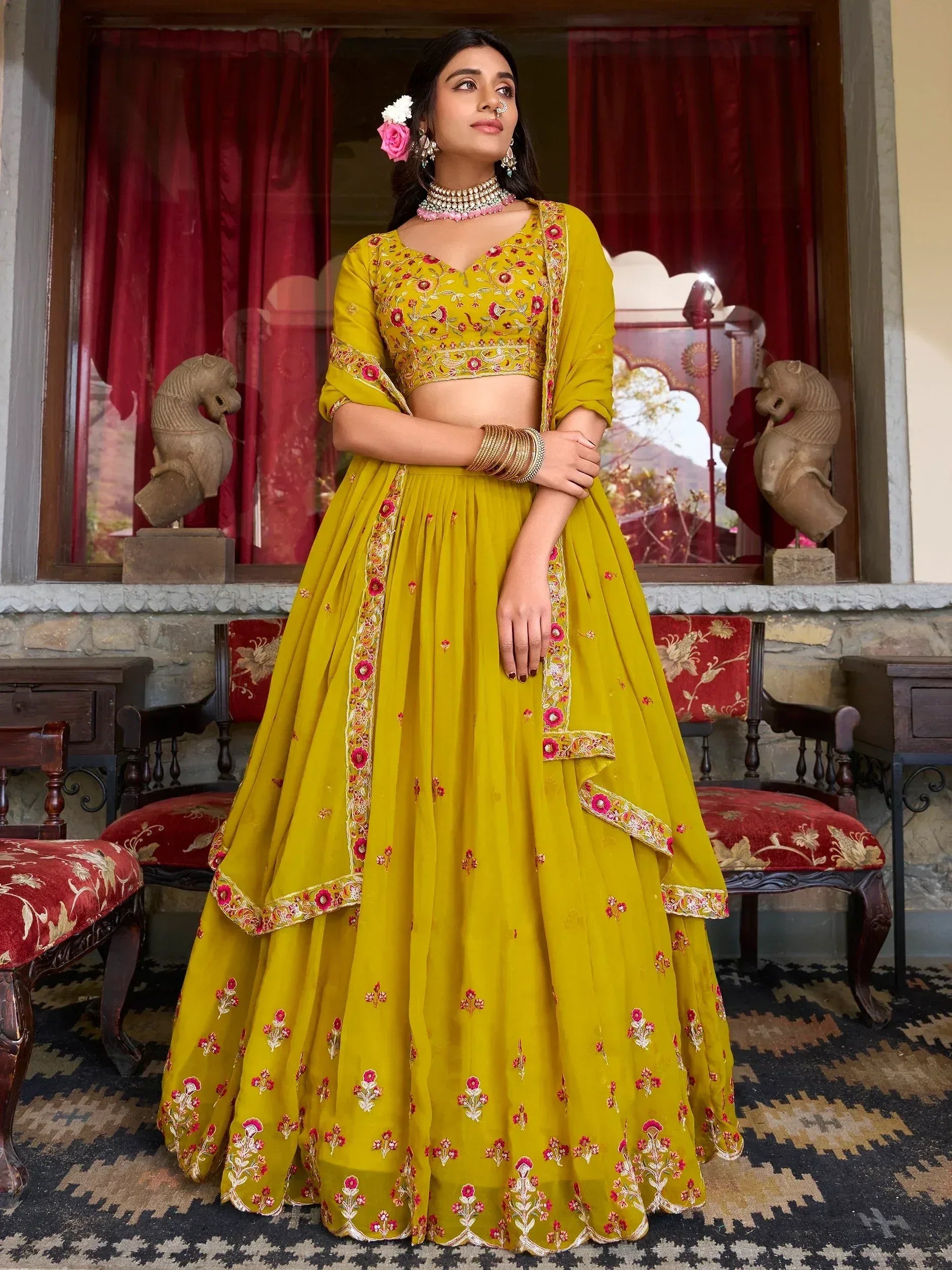 Yellow floral embroidered lehenga choli with pink accents, perfect for Indian ethnic wear occasions