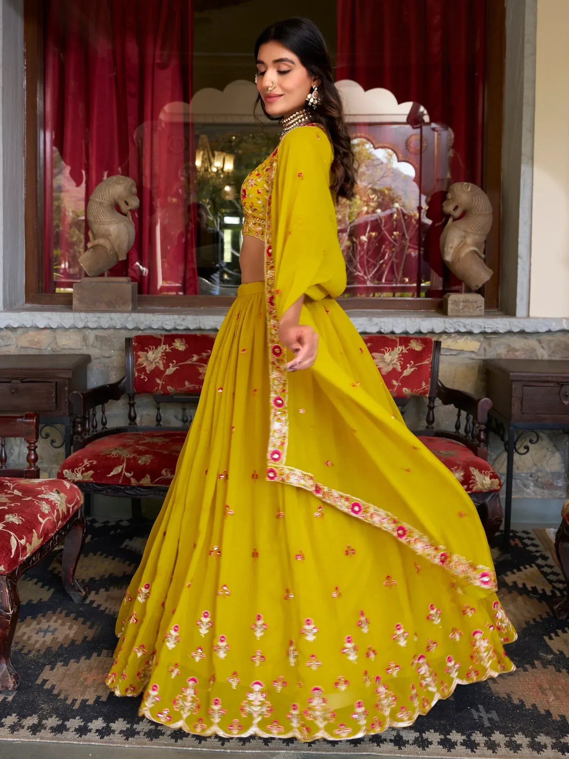 Yellow embroidered lehenga choli with floral motifs, perfect for Indian ethnic wear and festive occasions.